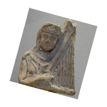 Terracotta harpist from 3rd century B.C.  Artifact is housed in the Louvre Museum in Paris, France.